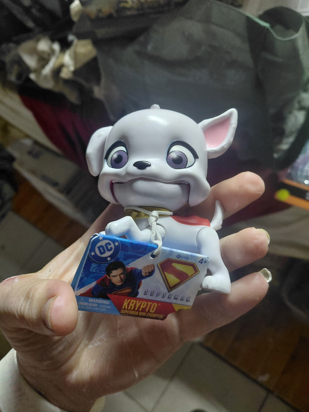 DC Comics Krypto the Superdog mini toy figure with a tag attached.